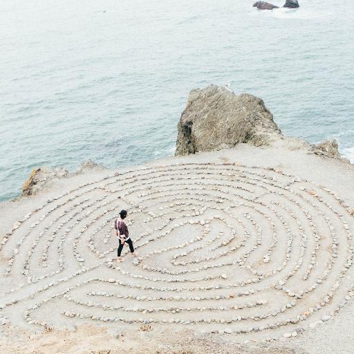 person walking on beach during daytime